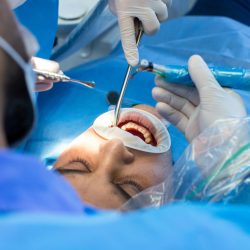 dentist and assistant with tool makes some manipulations in the patient’s mouth dentist and assistant with tool makes some manipulations in the patient's mouth